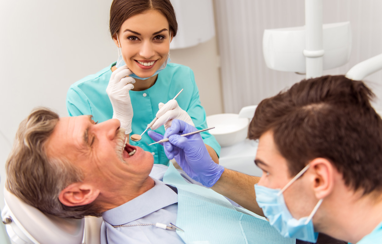 dentists working on patient