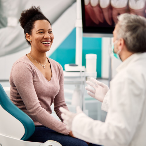 smiling woman in dentist chair